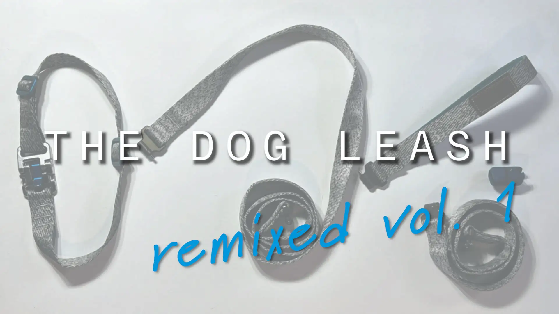 Still frame from 'The Dog Leash Remixed Vol 1' stop-motion video. A modular Zumi leash system, featuring custom grey webbing and a teal Orca buckle, is arranged on a clean white surface. The Zumi dog head logo is prominently displayed in the center.